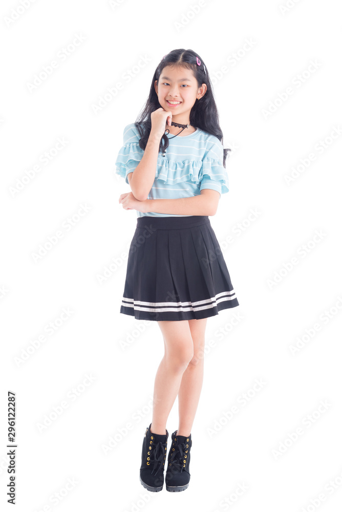 Full length of pretty asian teenage girl smiling isolated over white background Full length of pretty asian teenage girl smiling isolated over white background