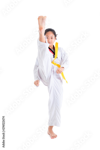 Young asian girl having taekwondo training ,one girl kicking over white background.