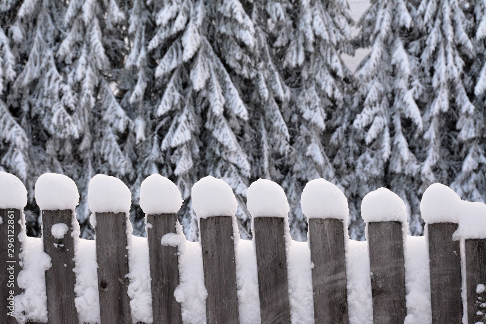 snow covereda wooden fence snow covereda wooden fence