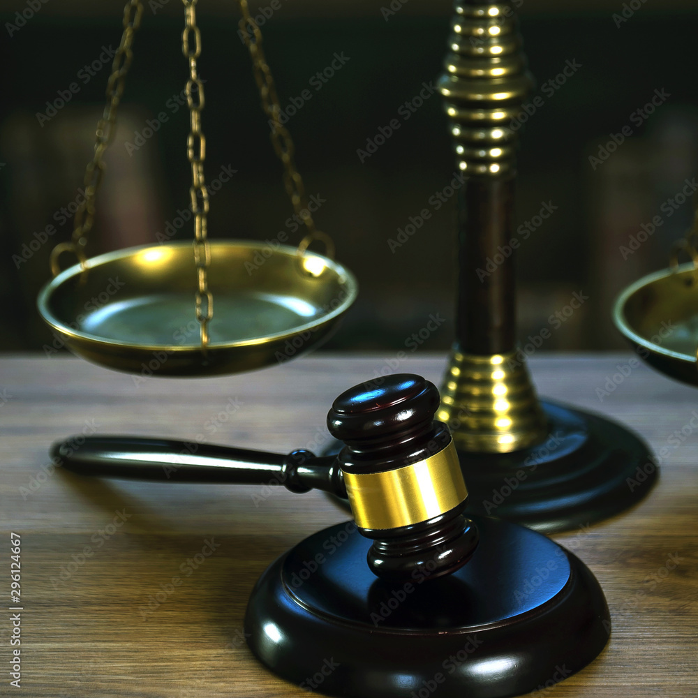 Law and Justice concept. Mallet of the judge, books, scales of justice. Courtroom theme. Law and Justice concept. Mallet of the judge, books, scales of justice. Courtroom theme.