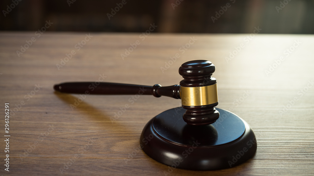 Law and Justice concept. Mallet of the judge, books, scales of justice. Courtroom theme. Law and Justice concept. Mallet of the judge, books, scales of justice. Courtroom theme.