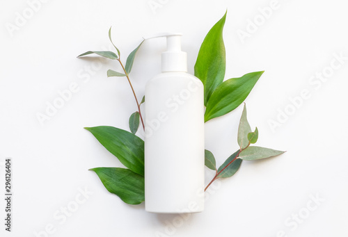 Natural organic cosmetic packaging plastic mock up with leaves. Mock-up bottle for branding.