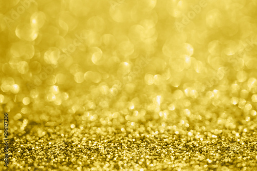 Abstract blur gold glitter sparkle defocused bokeh light background