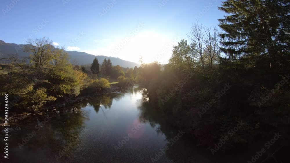 4K AERIAL Rising above a mountain river at sunset 4K AERIAL Rising above a mountain river at sunset