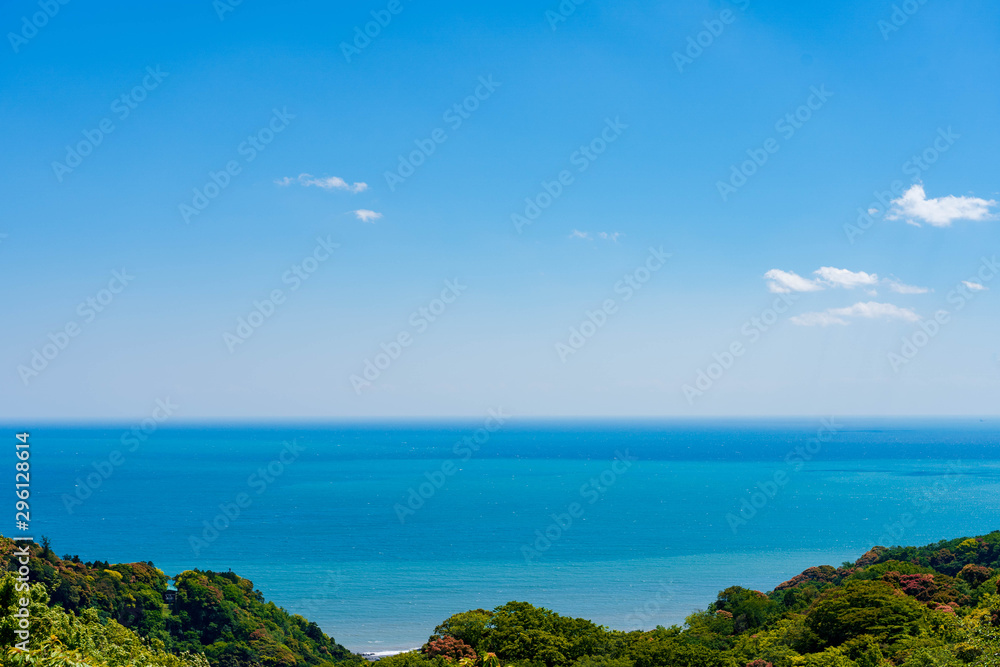 Beautiful sea or ocean view in blue color in layer tone , sea view from mountain or hill , sunrise to seascape with clear blue sky clouds.