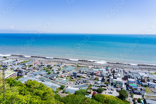 Fuji Mountain and seascape view background, famous landmark of Shimizu port, Suruga Bay on sunny day, clear blue sky and Blue Ocean in Shizuoka city, Japan.