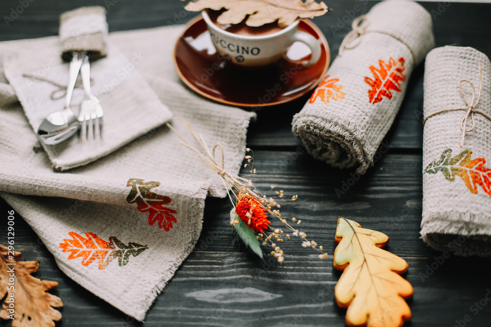View from above on table with linen kitchen towels and coffee cup. Table setting. Stylish autumn flat lay. fall home decoration View from above on table with linen kitchen towels and coffee cup. Table setting. Stylish autumn flat lay. fall home decoration