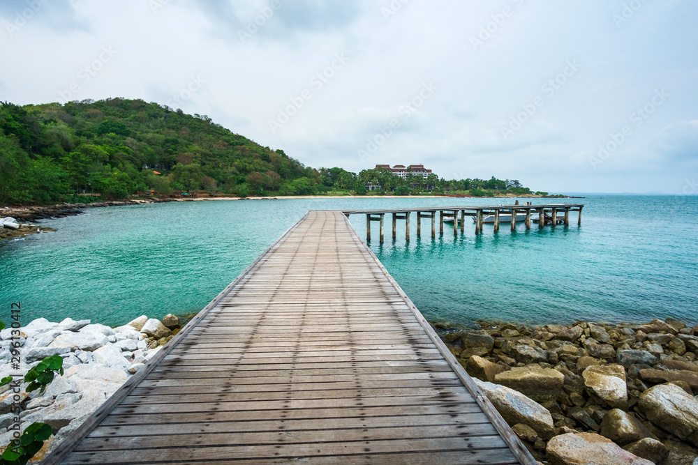 Wood bridge in to the sea