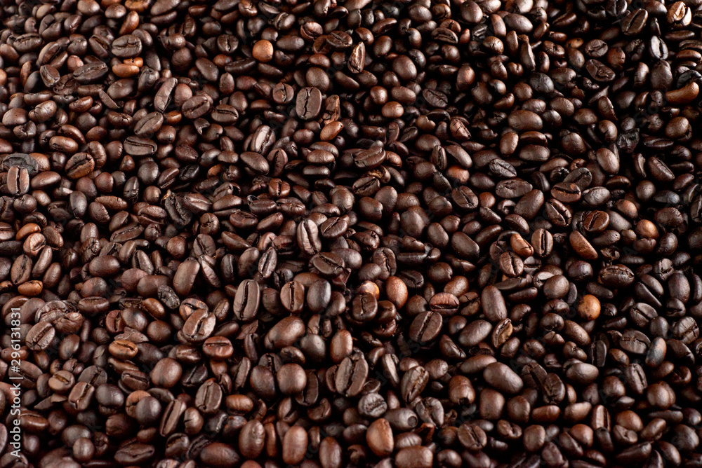 Roasted coffee beans background, arabica and robusta.