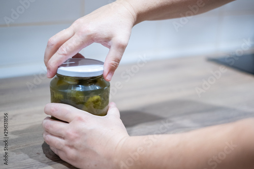 Pickled cucumbers, gherkins, dill, vegetable, food photography, unscrew lid photo