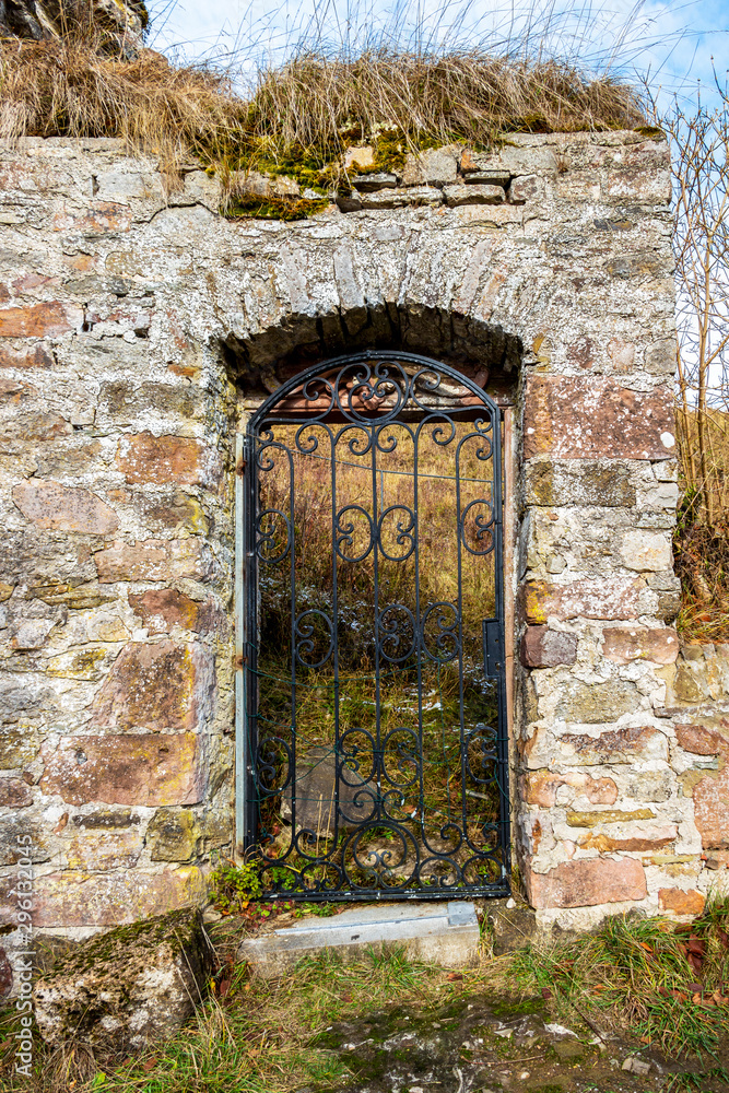 Beautiful old door to Kronenburg Castle ruins in winter, at Kronenburg, North Rhine-Westphalia, Germany Beautiful old door to Kronenburg Castle ruins in winter, at Kronenburg, North Rhine-Westphalia, Germany
