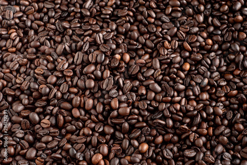 Roasted coffee beans background, arabica and robusta. © Thanapon