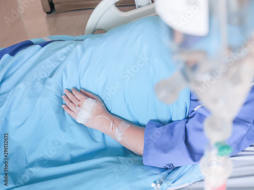 patient in hospital with saline intravenous (iv), saline into the body for treatment