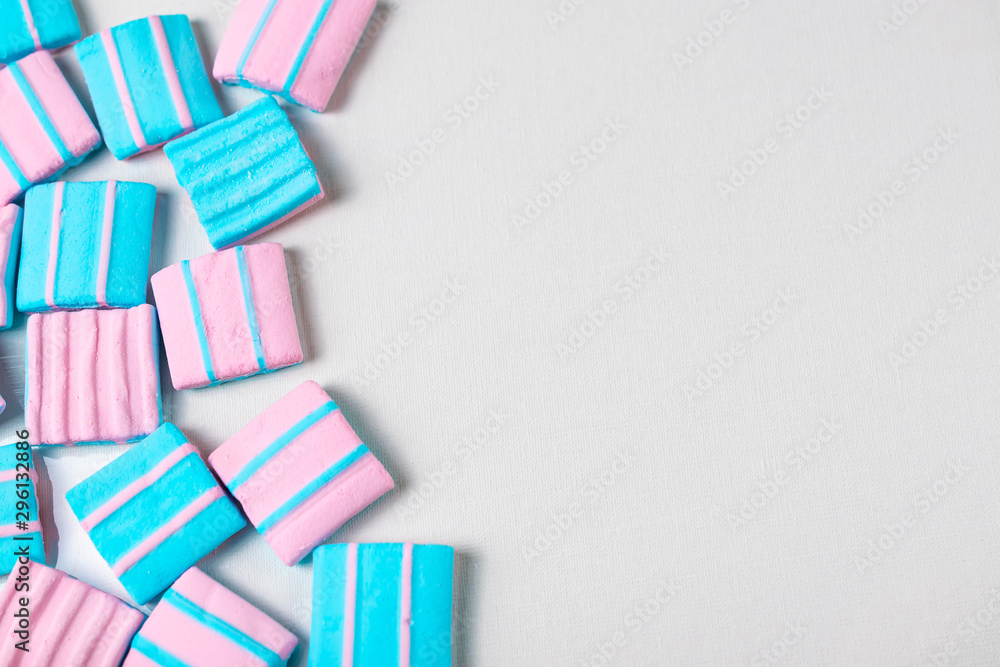 Obraz premium Abstract background with lots of colorful pink and blue marshmallows. Flat lay overhead