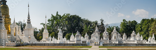 Panoramic view of golden and white pagoda at Wat Suan Dok Temple in Chiang Mai, Thailand. © sonatalitravel