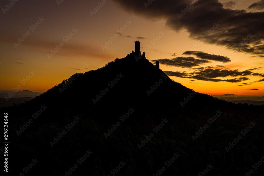 At the top of the mountain there is the ruin of a mediaeval castle, of which two towers and some wall fragments are still standing At the top of the mountain there is the ruin of a mediaeval castle, of which two towers and some wall fragments are still standing