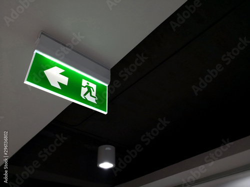 Wallpaper Mural Emergency fire exit sign show the way to escape Torontodigital.ca