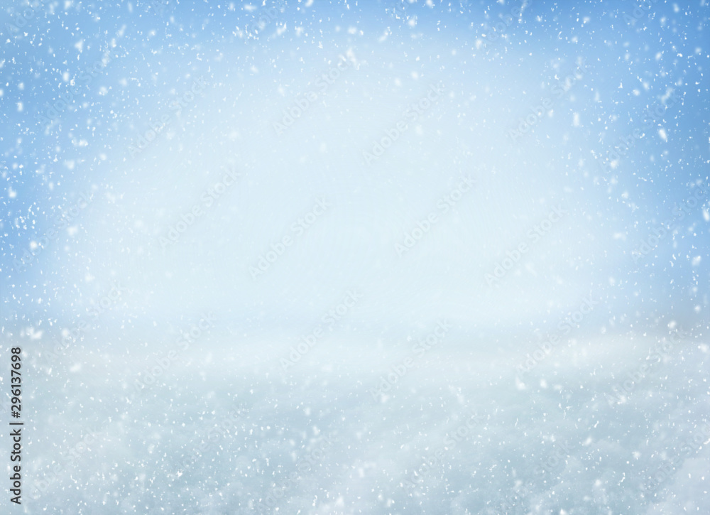 Obraz premium Winter Christmas background with falling snowflakes on blue background. Background for design with copy space
