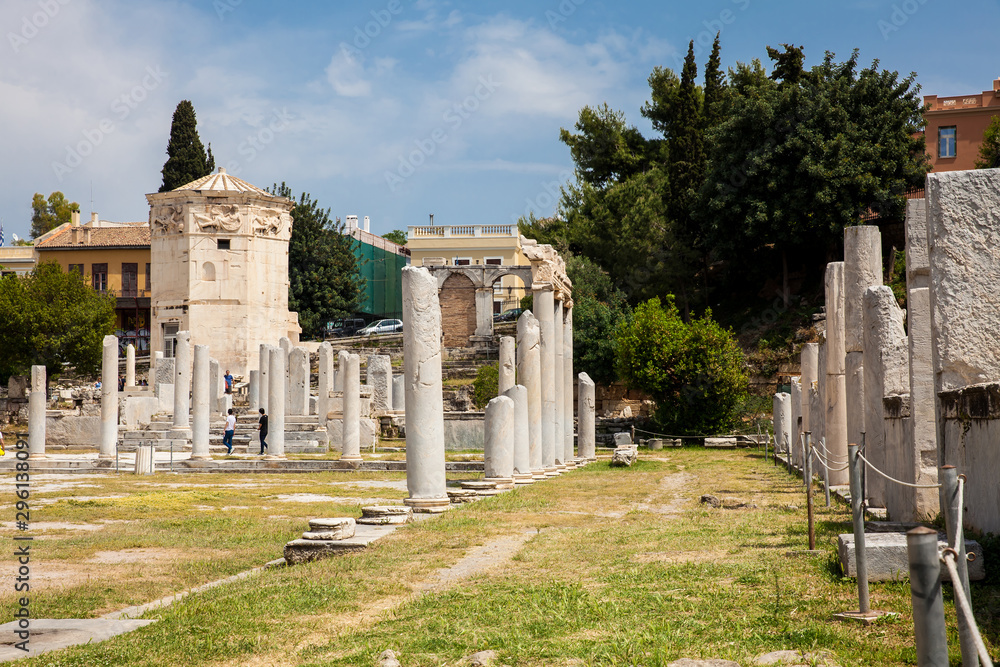 Tourists visiting the ancient ruins at the Roman Agora located to the north of the Acropolis in Athens