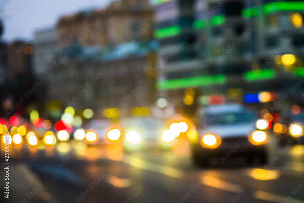 Abstract blurred background of evening city.Night traffic,colorful lights Abstract blurred background of evening city.Night traffic,colorful lights