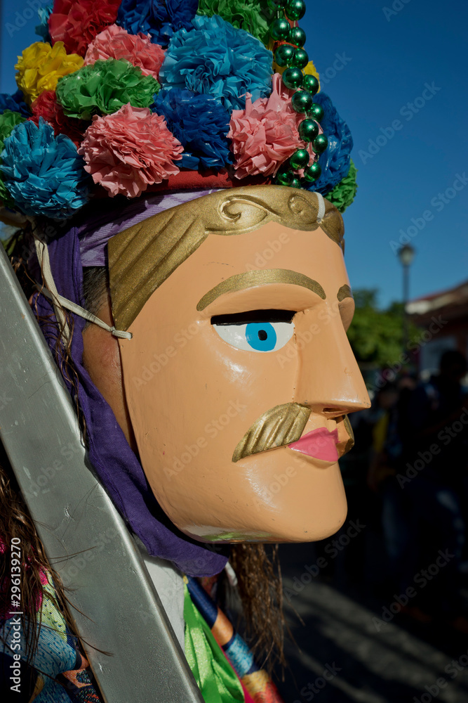 Masked reveller at carnival parade in Granada,Nicaragua Masked reveller at carnival parade in Granada,Nicaragua