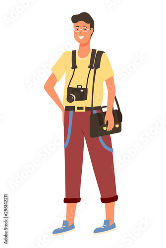 Young amator photographer in glasses, photo camera on neck and sack on shoulders. Smiling correspondent, paparazzi with professional equipment isolated. Vector illustration in flat cartoon style