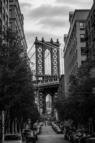 View of one of the towers of the Manhattan Bridge from the streets of the DUMBO district, Brooklyn, NYC black and white