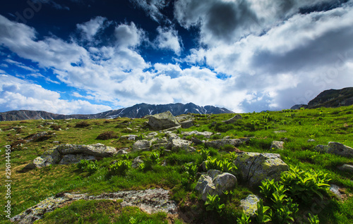 Beautiful spring scenery in the Transylvanian Alps, with ominous storm clouds