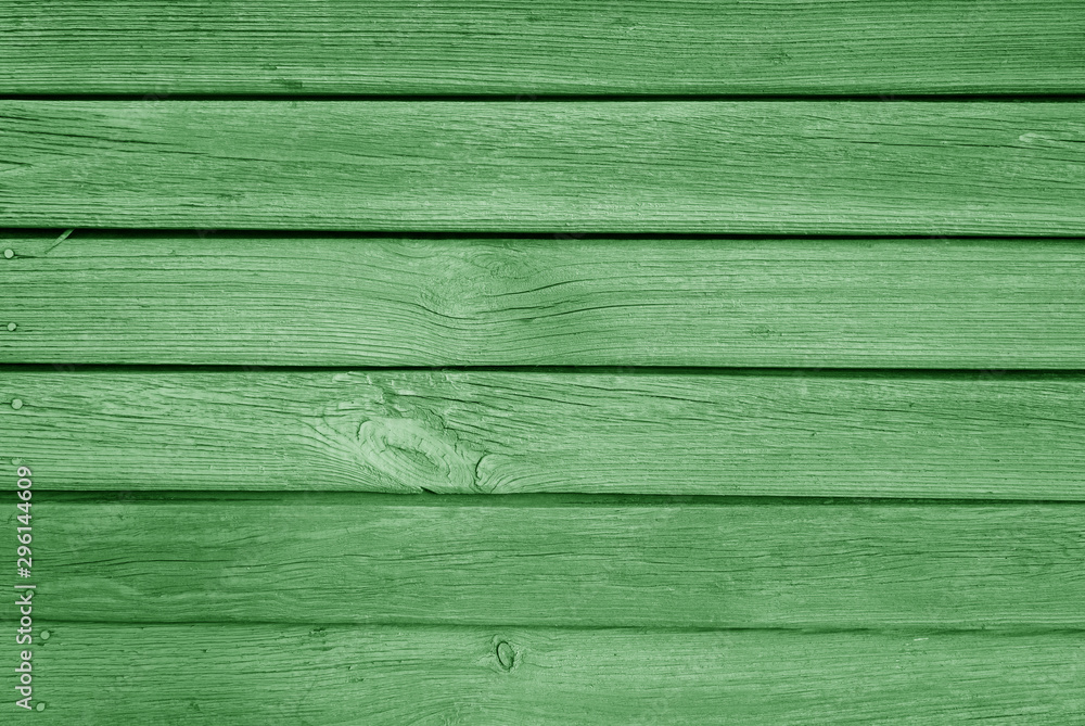 Old grungy wooden planks background in green color.