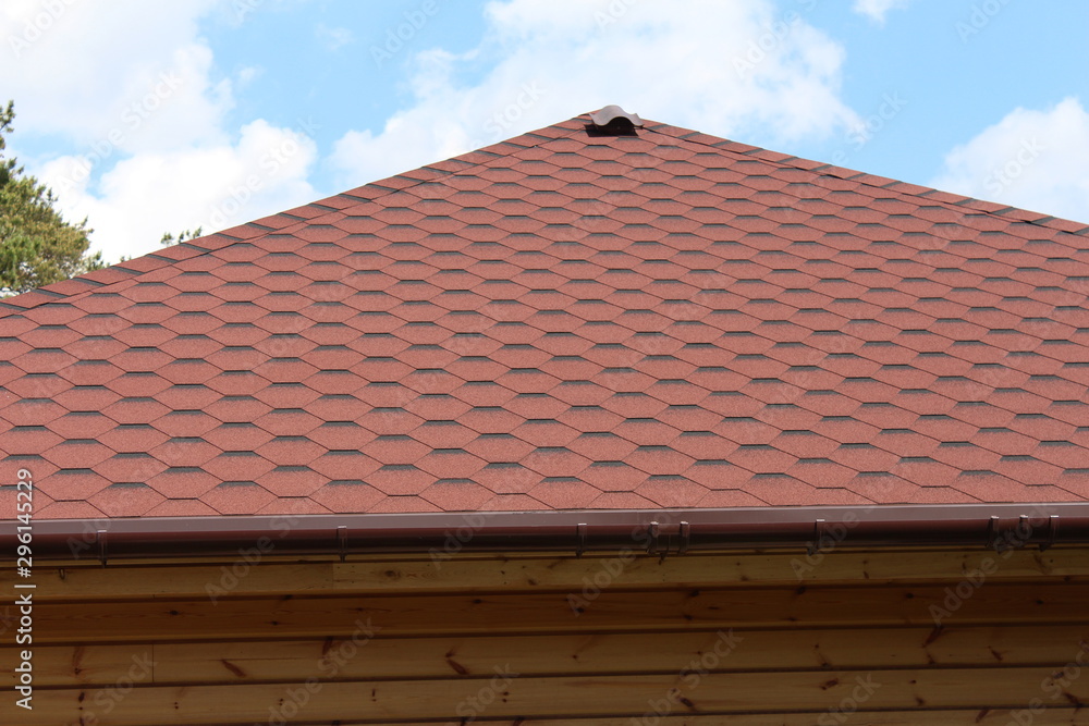Roof from a soft covering roofing material roof of the house, soft tiles Roof from a soft covering roofing material roof of the house, soft tiles