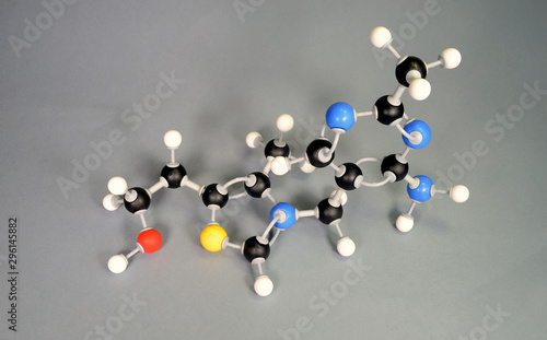 Molecule model of Vitamin B1. White is Hydrogen, black is Carbon, red is  Oxygen,  White is Hydrogen, black is Carbon, red is Oxygen, yellow is Sulphur and blue is Nitrogen. photo