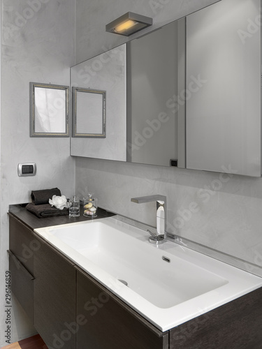 interior view of a modern bathroom with close up on the washbasin