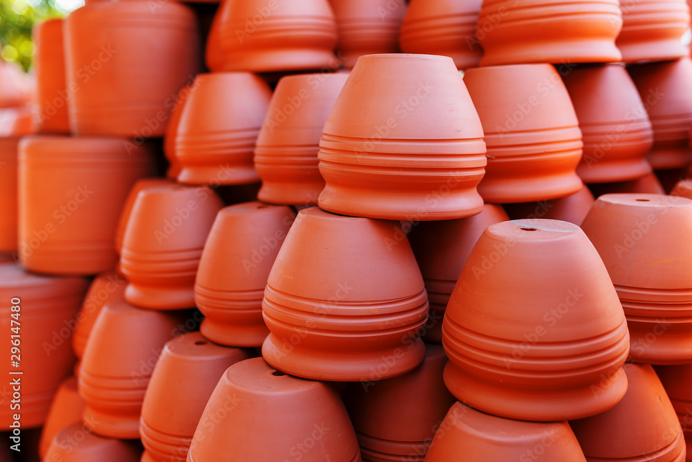 Handmade ceramic crockery made of clay of brown terracotta color Handmade ceramic crockery made of clay of brown terracotta color