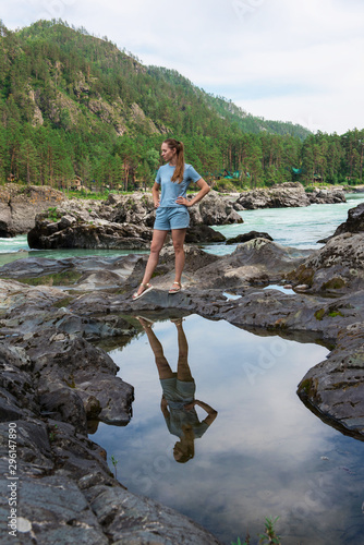 Woman resting at river in A...