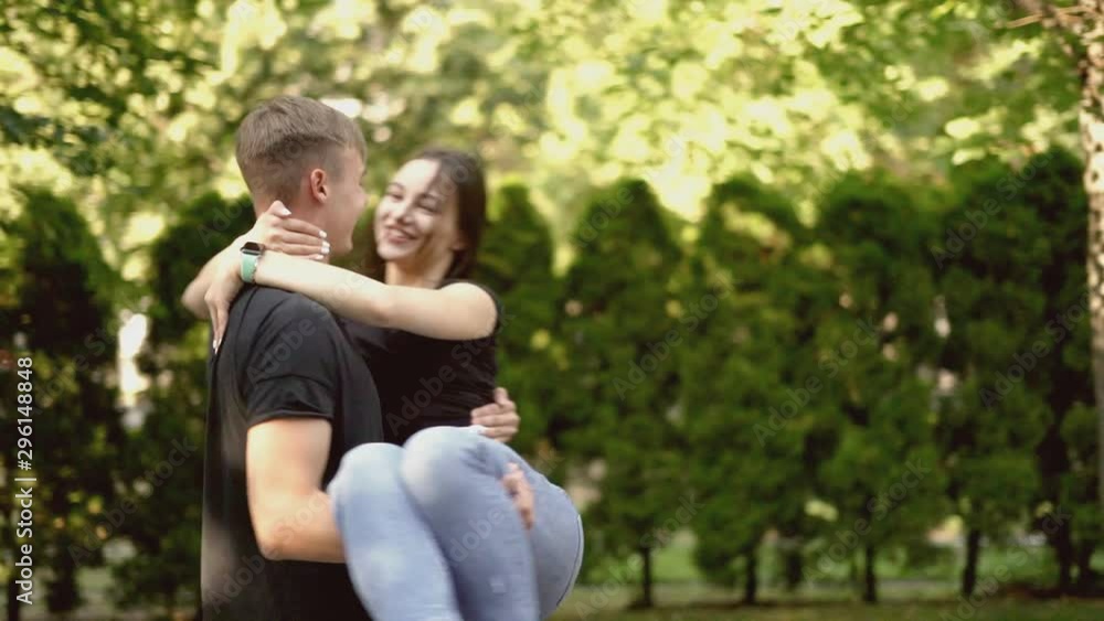 Cheerful, happy, loving couple whirls in the city alley. Cheerful, happy, loving couple whirls in the city alley.