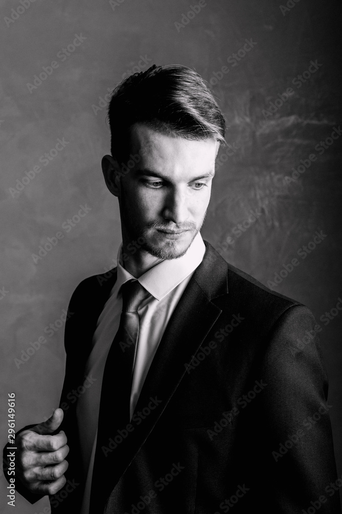 Portrait of a man black-white. Brutal man in a suit. Portrait of a man black-white. Brutal man in a suit.