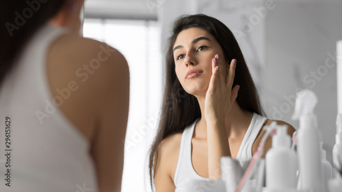 Young Woman Touching Face Skin Standing In Bathroom, Panorama