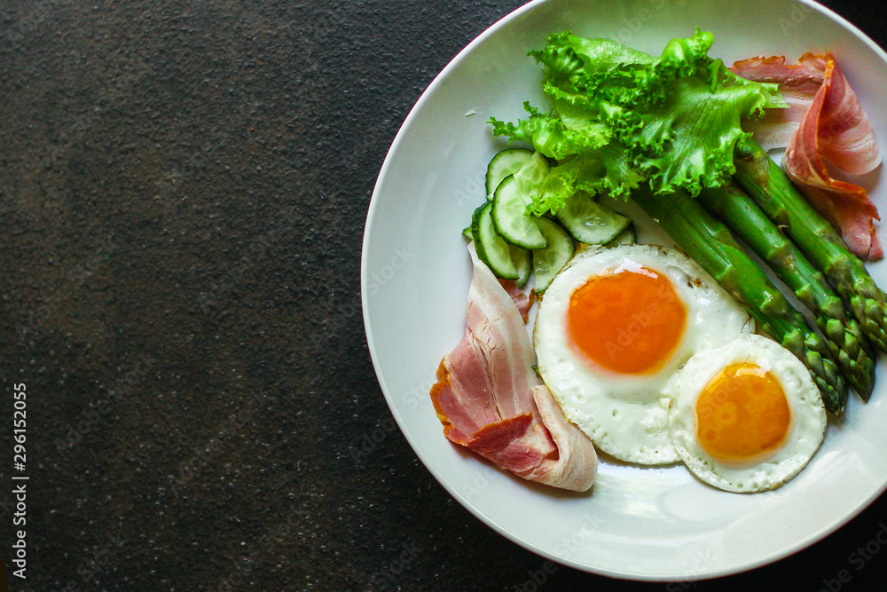 healthy breakfast (fried eggs, bacon, vegetables, asparagus beans, coffee and more) menu concept. food background. copy space. Top view healthy breakfast (fried eggs, bacon, vegetables, asparagus beans, coffee and more) menu concept. food background. copy space. Top view