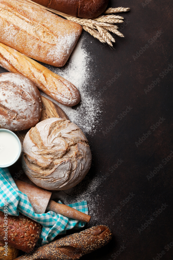 Various crusty bread and cup of milk Various crusty bread and cup of milk