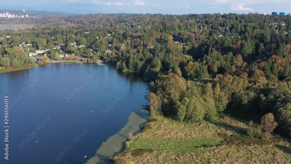 Aerial View at Mountain Lake with Blue Sky in British Columbia, Canada. 4K. Aerial View at Mountain Lake with Blue Sky in British Columbia, Canada. 4K.