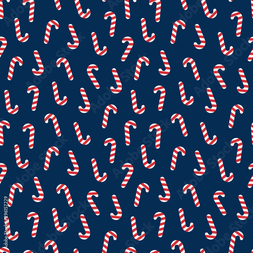 Seamless christmas pattern with caramel cane on a blue background. Cute vector illustration Poster for your business design.