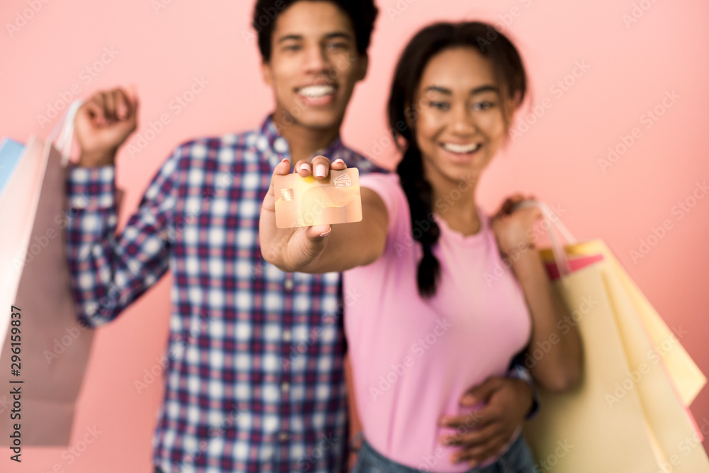 Happy customers. Cheerful teens recommend credit card Happy customers. Cheerful teens recommend credit card