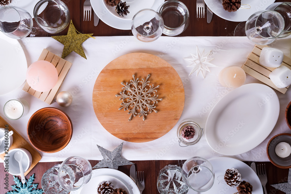 Christmas table setting plate and decoration on dark wooden table, flat lay Christmas table setting plate and decoration on dark wooden table, flat lay
