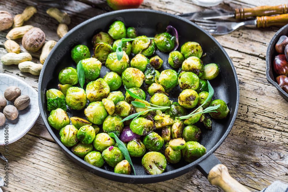 Frying pan with roasted brussel sprouts on table Frying pan with roasted brussel sprouts on table
