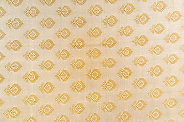 Maski, India - October ,6 2019 - Traditional Indian Silk Saree border pattern with golden bright colors and floral design.