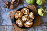 Baked quince with cheese and cinnamon in a pan. Healthy snack or dessert. Selective focus. Macro.