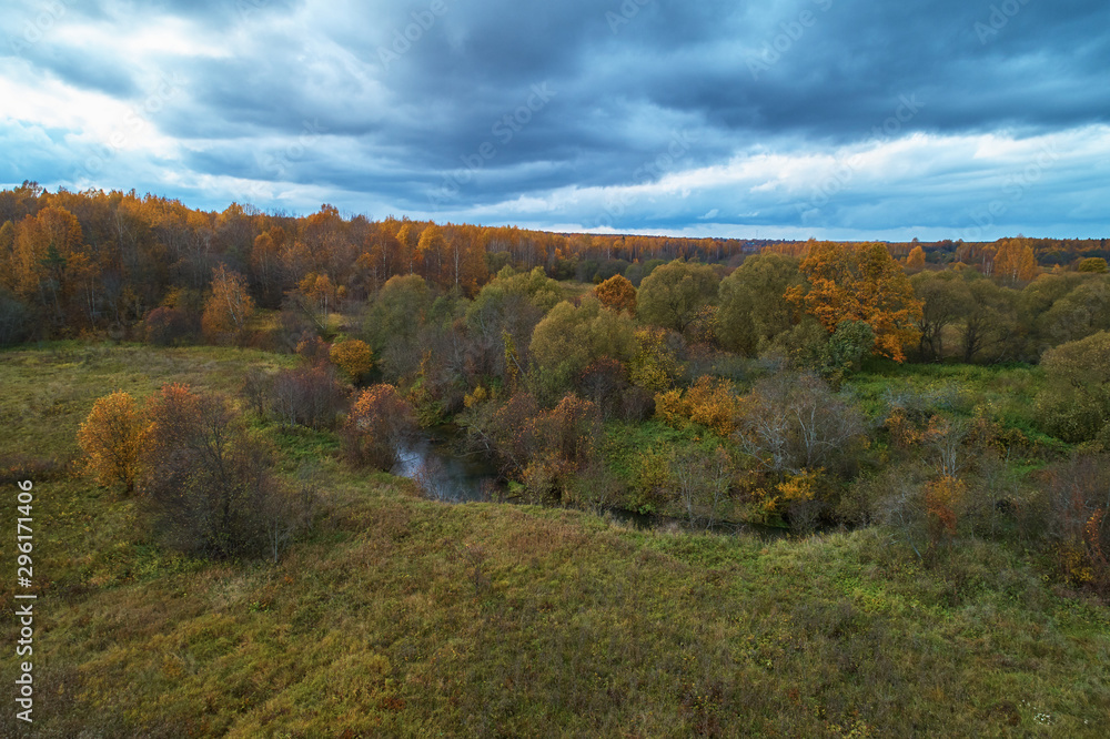 Aerial view with a drone. Landscape with autumn forest and river Aerial view with a drone. Landscape with autumn forest and river