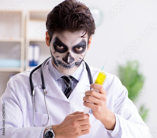 Scary monster doctor working in lab photo