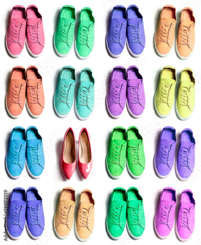 4 Pairs of colorful new sneakers on isolated white background