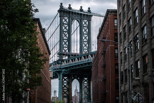 View of one of the towers of the Manhattan Bridge from the streets of the DUMBO district  Brooklyn  NYC 